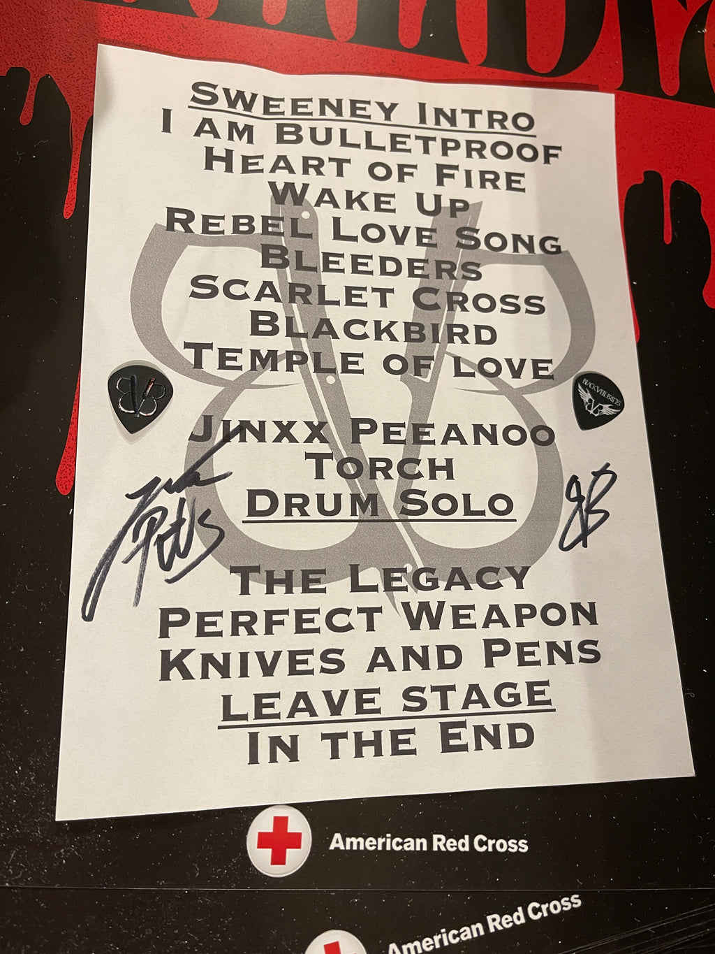 Signed BVB BLEEDERS 2024 Tour setlist and two signature Jake Pitts guitar picks.